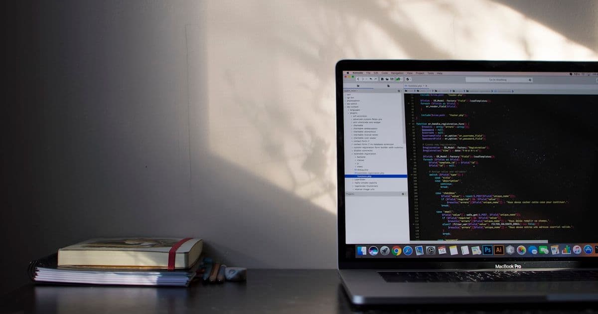 Developer workspace with laptop and code