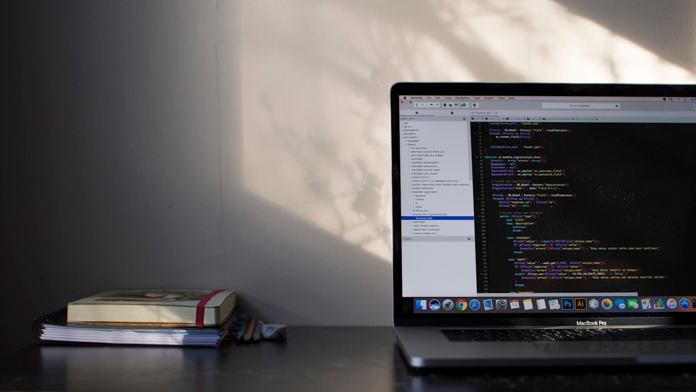 Developer workspace with laptop and code